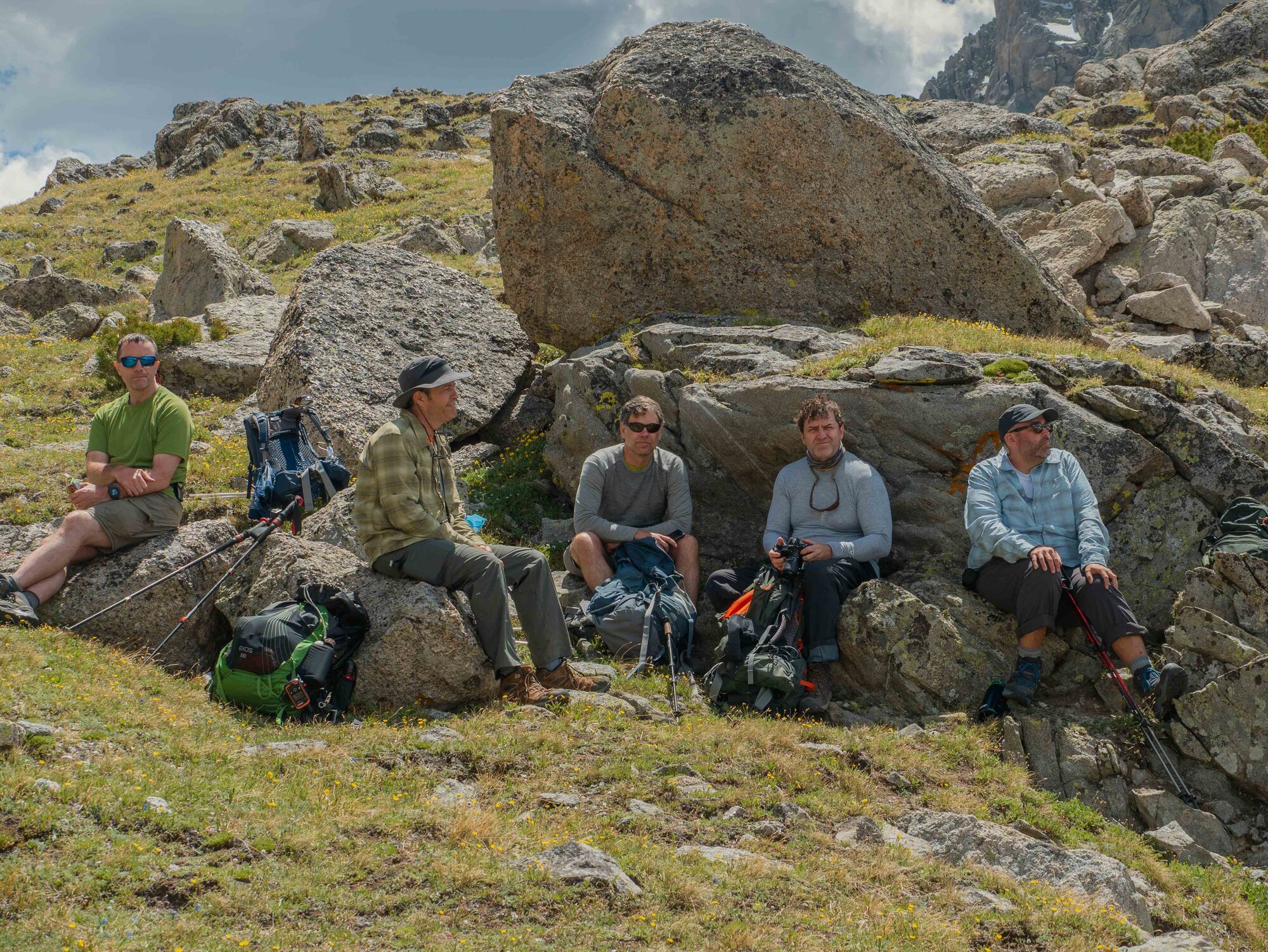 Group resting on boulders near Jackass Pass